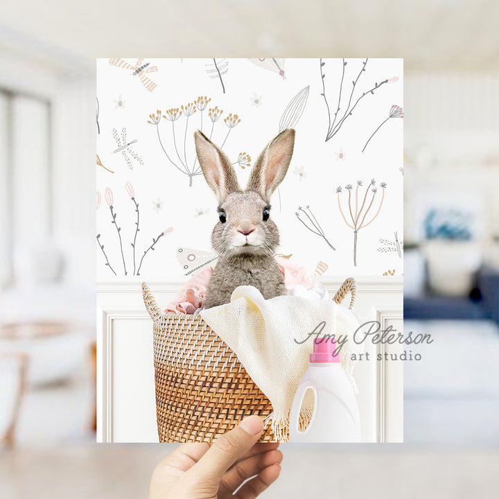 a person holding a picture of a rabbit in a basket