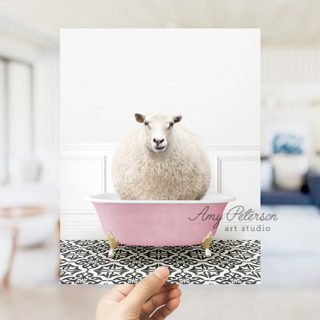 a sheep sitting in a pink bath tub