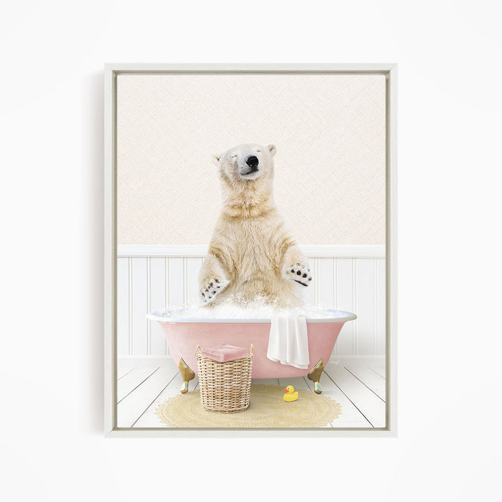 A polar bear sitting in a pink bathtub filled with bubbles, surrounded by a yellow rubber duck and a wicker basket.