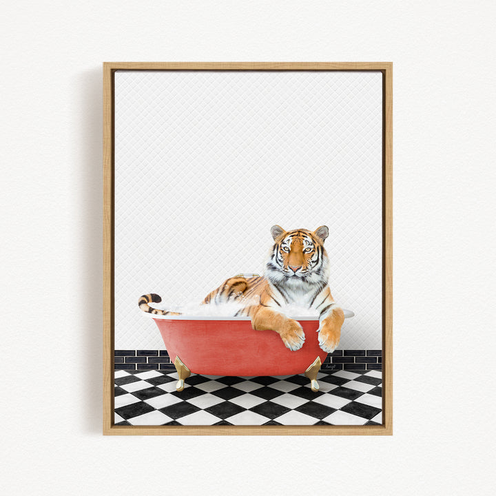 A tiger is sitting in a red bathtub on a black and white checkered floor.
