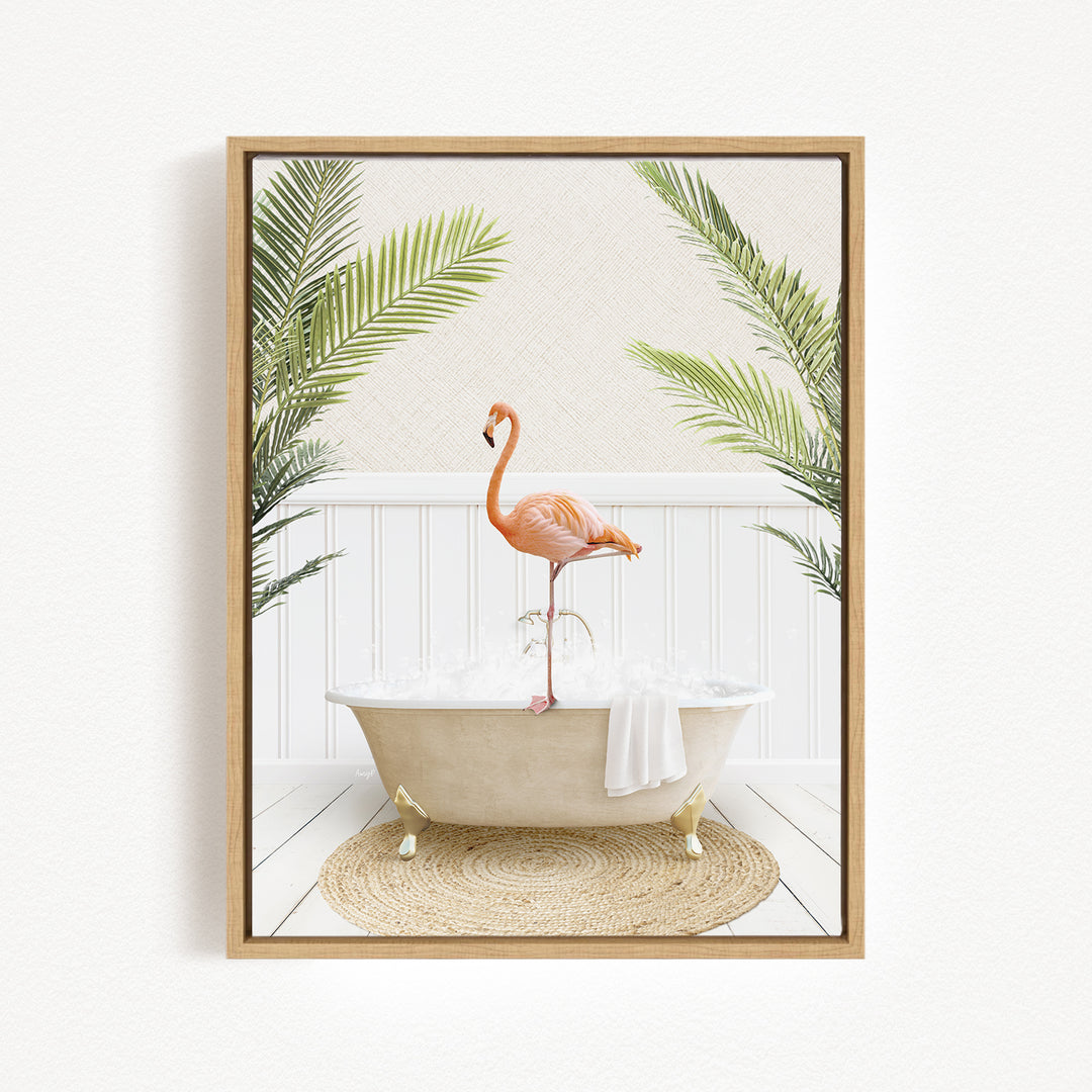 A framed image depicting a pink flamingo standing on the edge of a white bathtub, surrounded by green palm leaves.