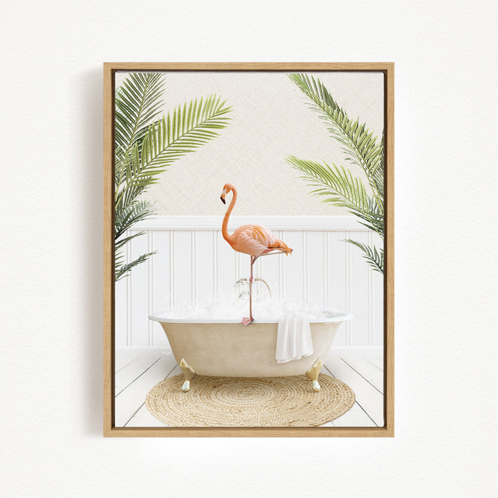 A framed image depicting a pink flamingo standing on the edge of a white bathtub, surrounded by green palm leaves.