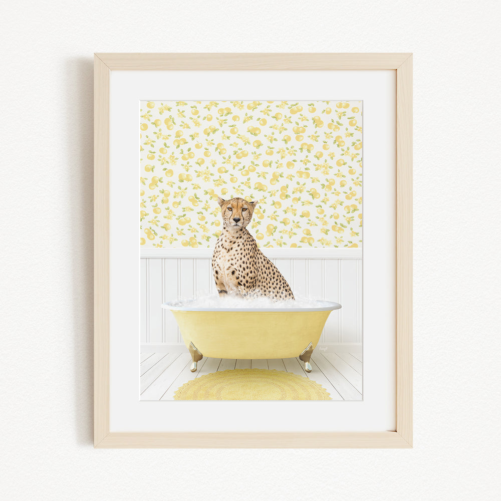 A cheetah sitting in a yellow bathtub filled with water, surrounded by a yellow floral wallpaper.