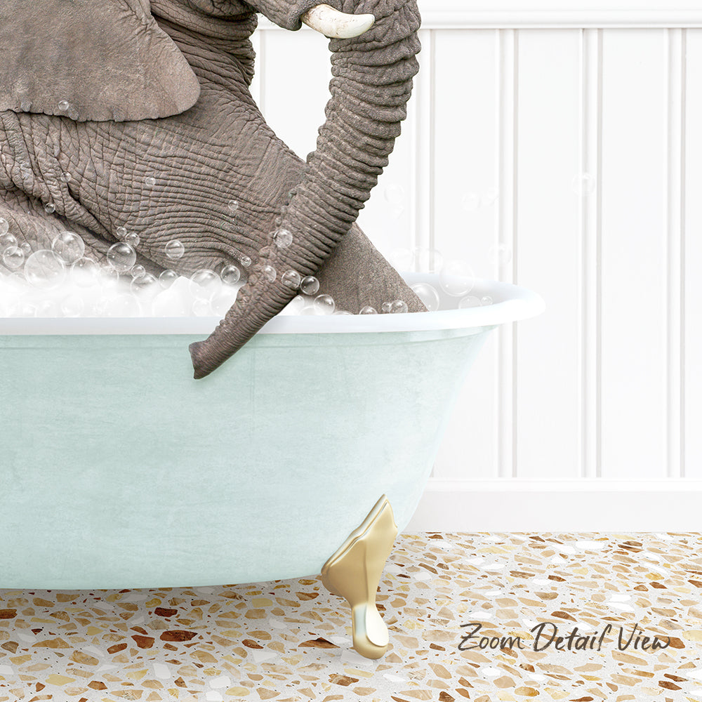 A large elephant is sitting in a bathtub filled with bubbles, creating a whimsical and playful scene.