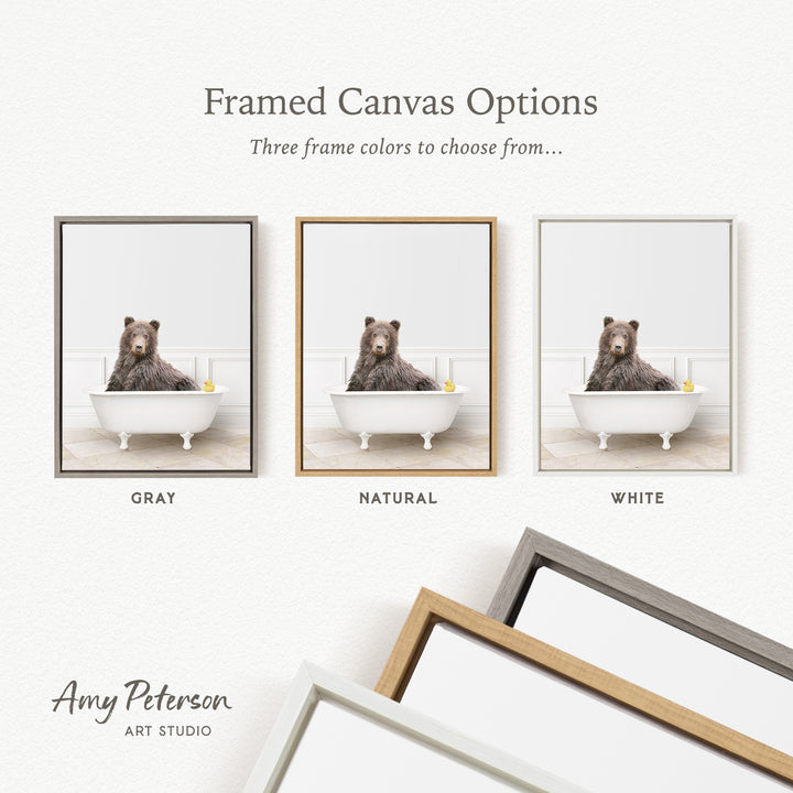 three framed canvas options, each featuring a brown bear sitting in a bathtub. The options include a gray frame, a natural frame, and a white frame.