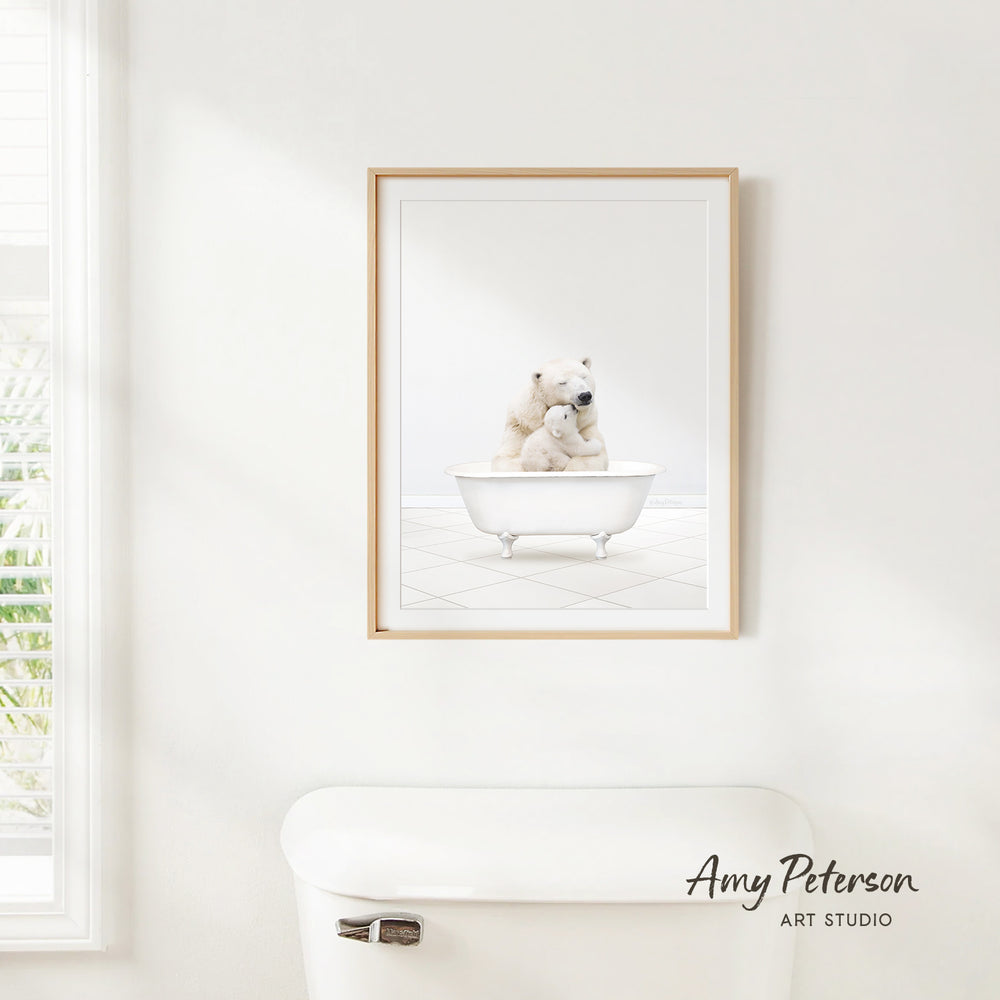 A framed image of a polar bear sitting in a bathtub, with a window and a white toilet visible in the background.