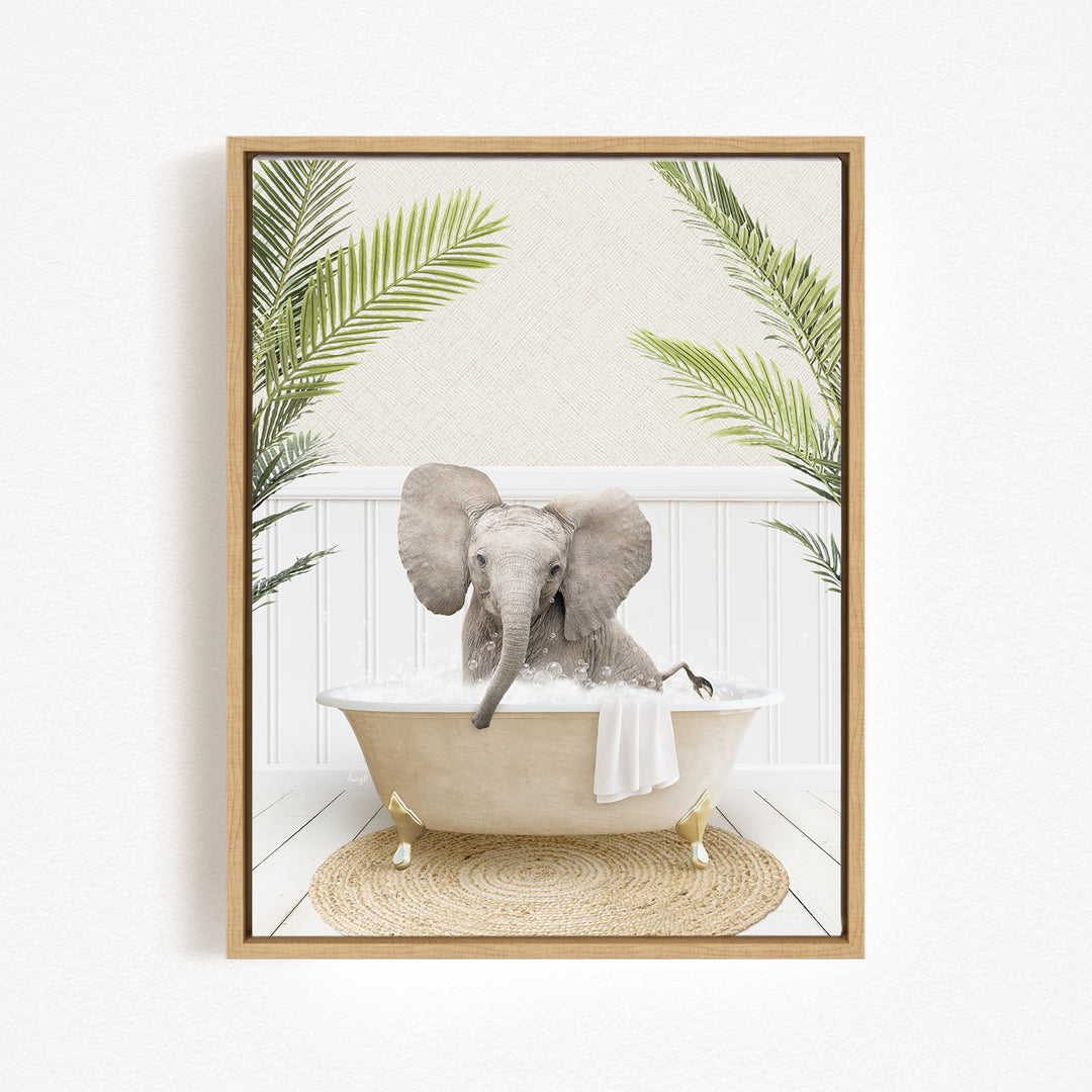 A baby elephant sitting in a bathtub filled with water, surrounded by palm leaves and a woven mat on the floor.