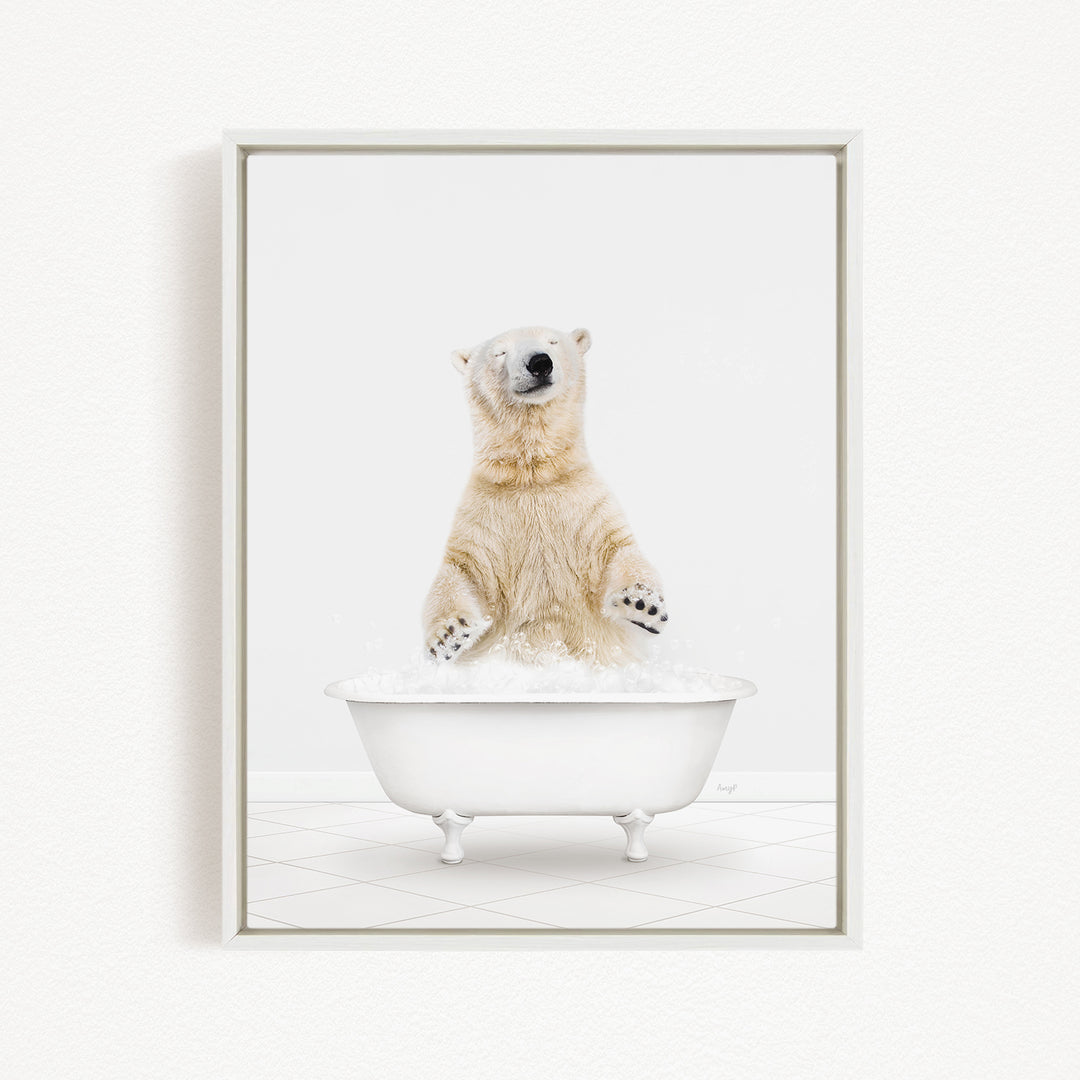 A polar bear standing in a white bathtub filled with water, appearing to be enjoying a bath.