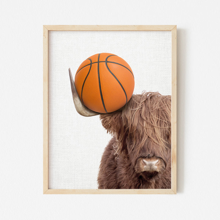 a bull with a basketball on its head