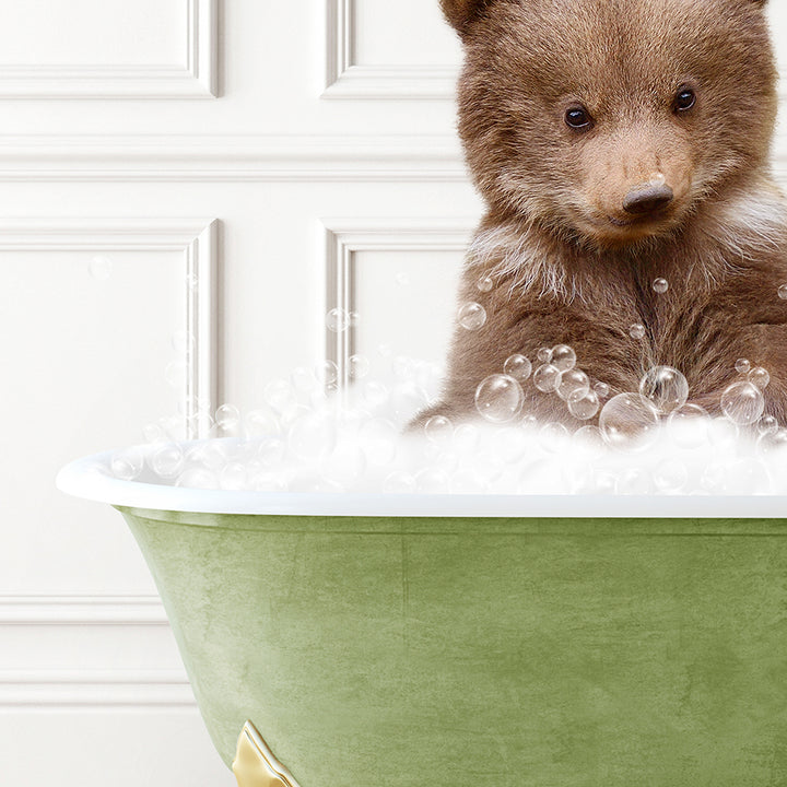 a brown bear sitting in a bath tub filled with bubbles