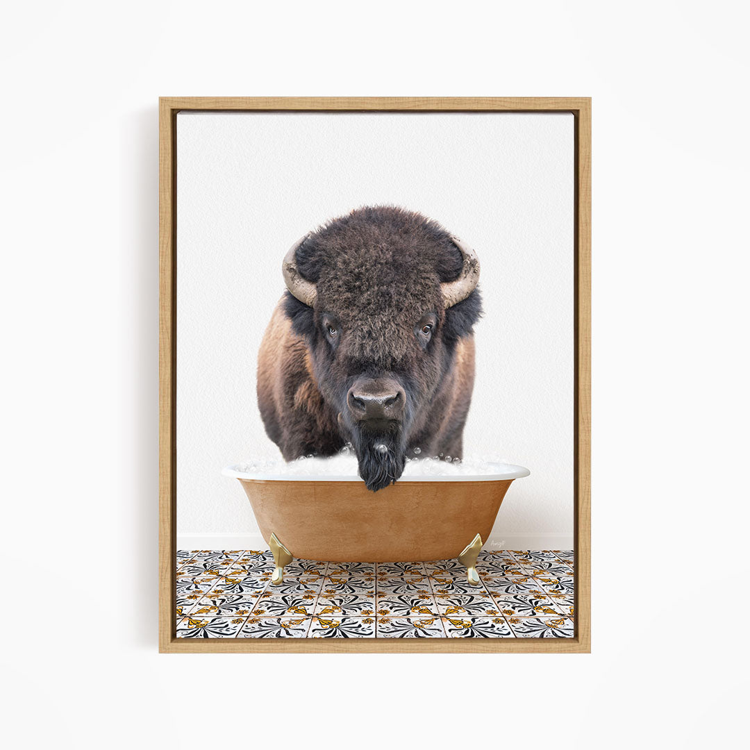 A buffalo with large horns is standing in a large bowl of water, with a patterned tile floor beneath it.
