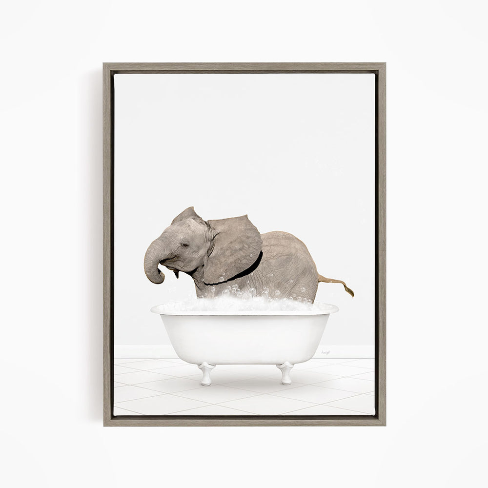 A gray elephant is standing in a white bathtub filled with bubbles, creating a whimsical and playful scene.