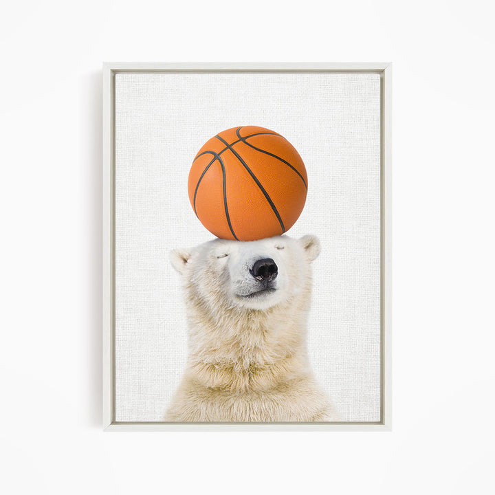 A polar bear balancing a basketball on its head.