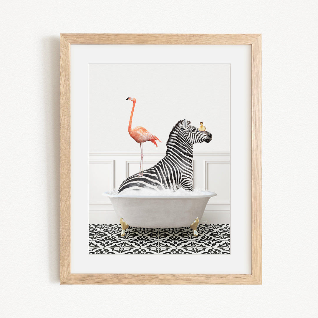 A framed image depicting a zebra sitting in a bathtub, with a flamingo standing on its back and a bird perched on its head.