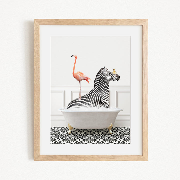 A framed image depicting a zebra sitting in a bathtub, with a flamingo standing on its back and a bird perched on its head.