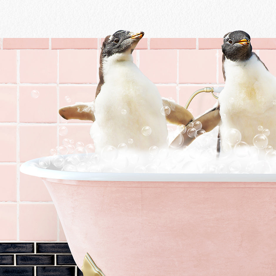 two penguins sitting in a bathtub with bubbles