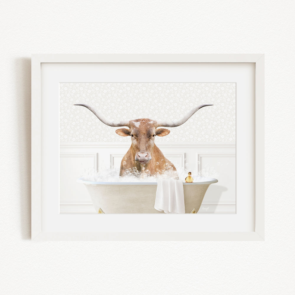 A bull with large horns is sitting in a bathtub filled with water, with a towel and a small figure nearby.