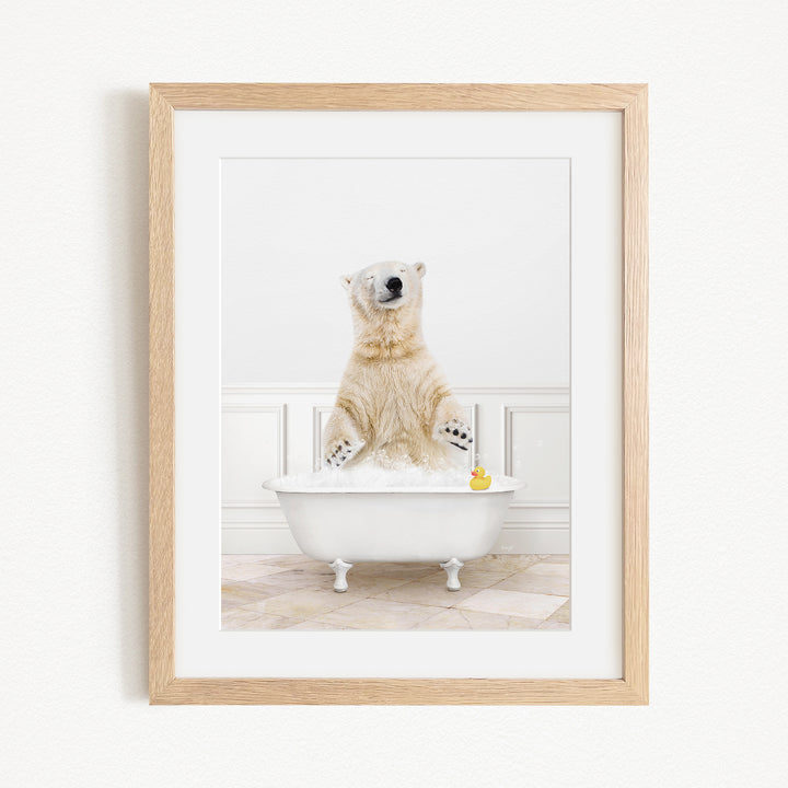 A polar bear is sitting in a bathtub filled with water, surrounded by a yellow rubber duck.