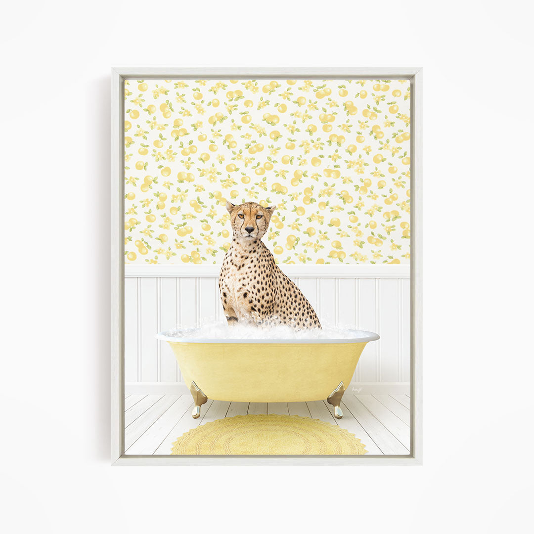 A cheetah sitting in a yellow bathtub filled with water, surrounded by a yellow and white floral patterned wall.
