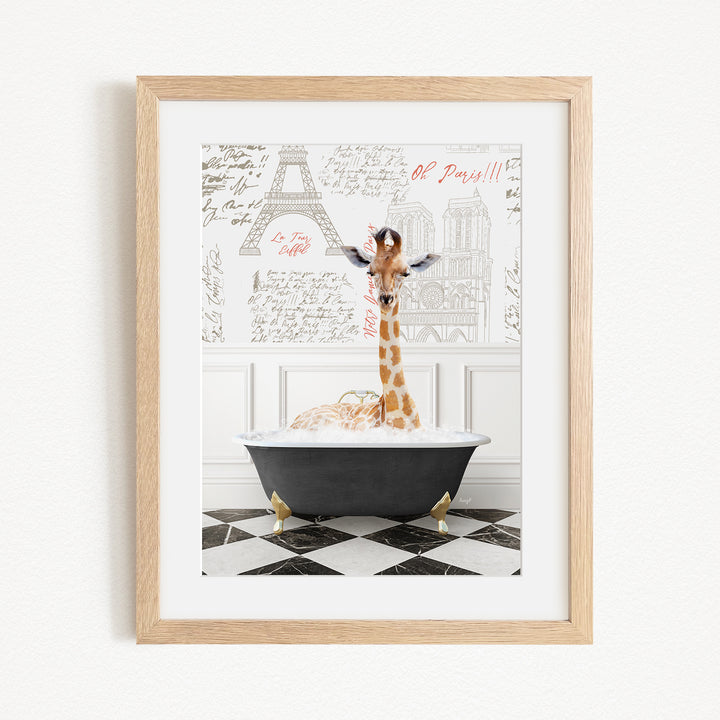 A giraffe standing in a bathtub filled with bubbles, with a framed picture of the Eiffel Tower in the background.