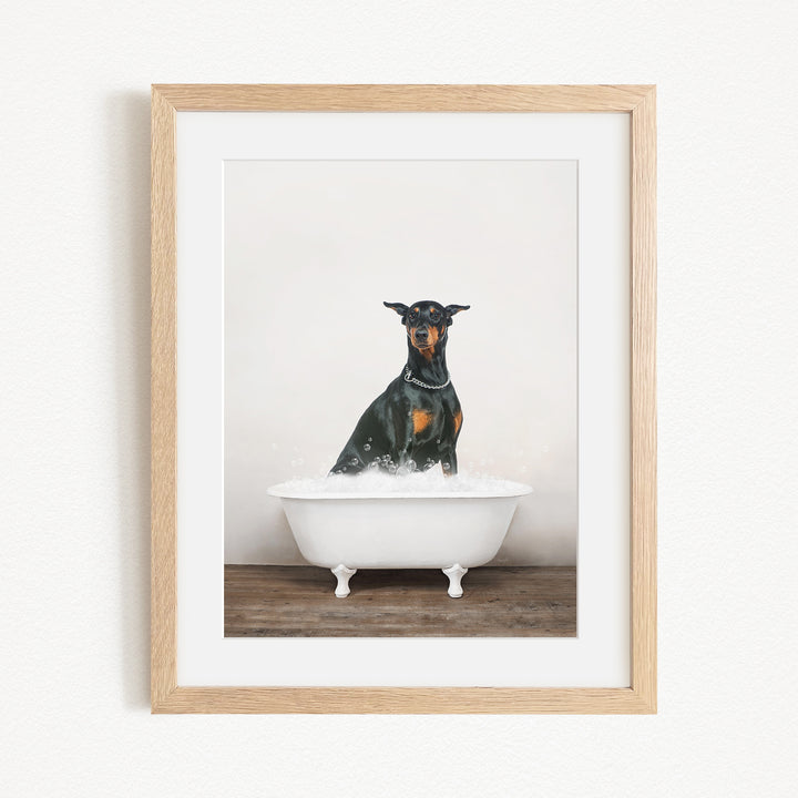 A black and tan dog sitting in a white bathtub filled with water, looking directly at the camera.