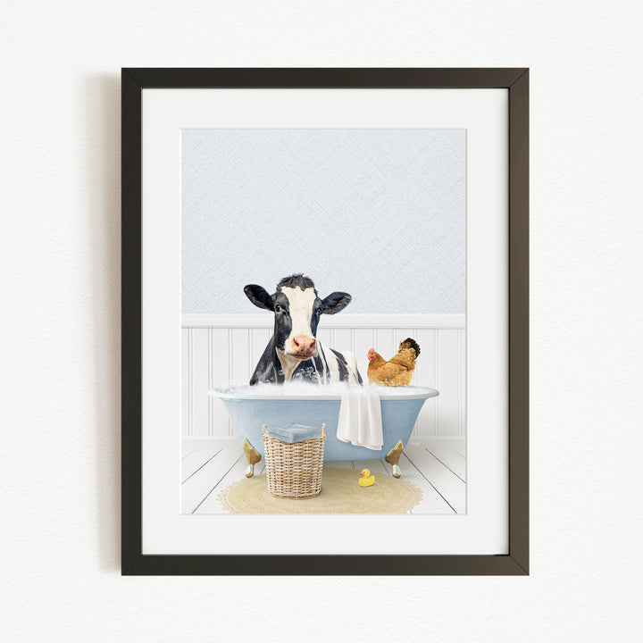 A black and white cow is sitting in a blue bathtub, surrounded by a chicken and a duck, creating a whimsical and playful scene.