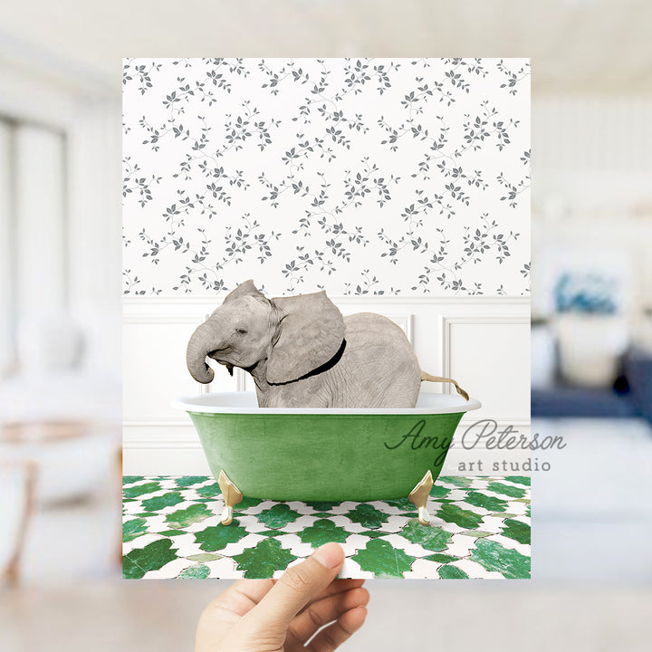 a hand holding a card with an elephant in a bathtub