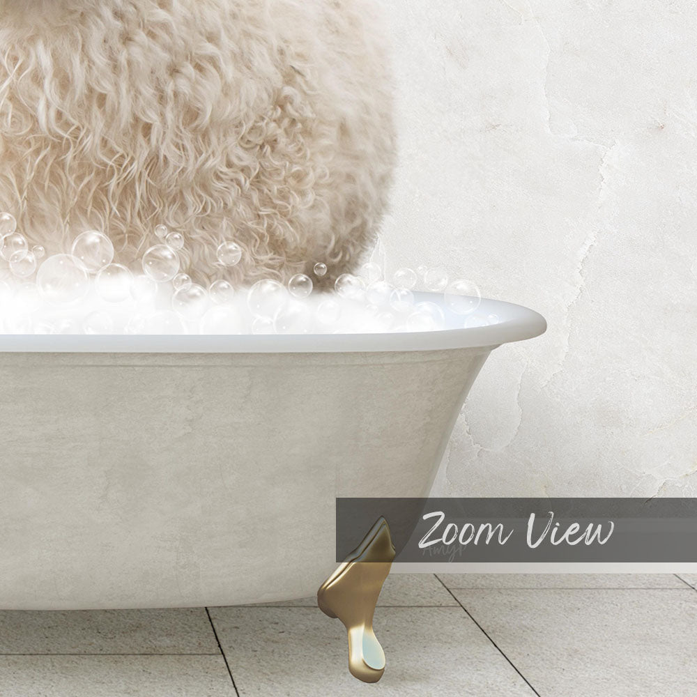 A fluffy white dog is sitting in a bathtub filled with bubbles, with a gold bathtub faucet visible.