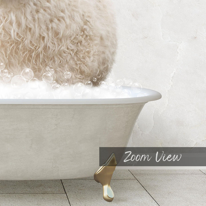 A fluffy white dog is sitting in a bathtub filled with bubbles, with a gold bathtub faucet visible.