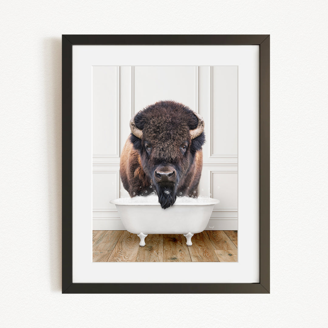A buffalo with a long beard is standing in a white bathtub, with its head above the water.