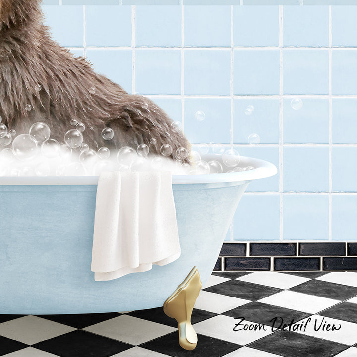 A fluffy brown dog is sitting in a blue bathtub filled with bubbles, with a white towel and gold shoe nearby.