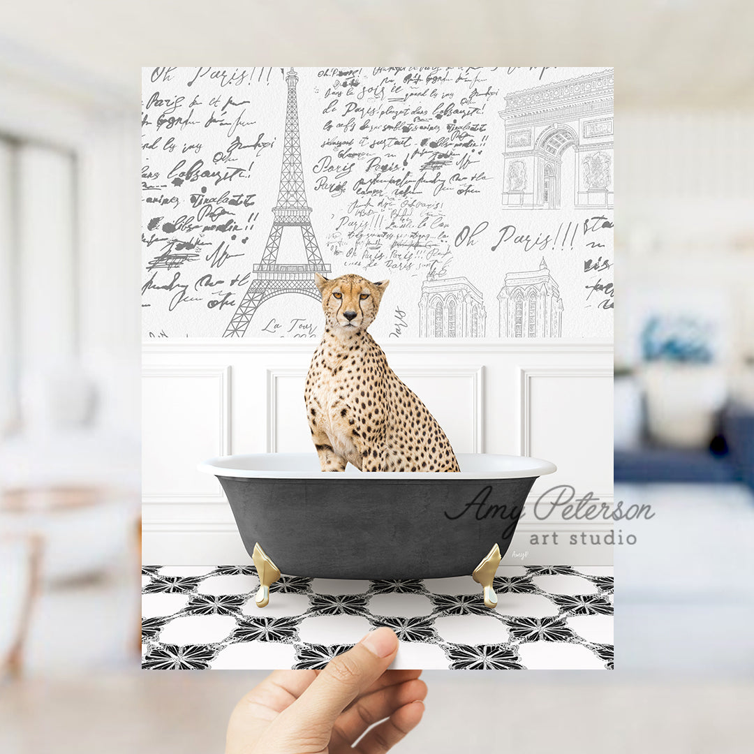 a hand holding a card with a cheetah sitting in a bathtub