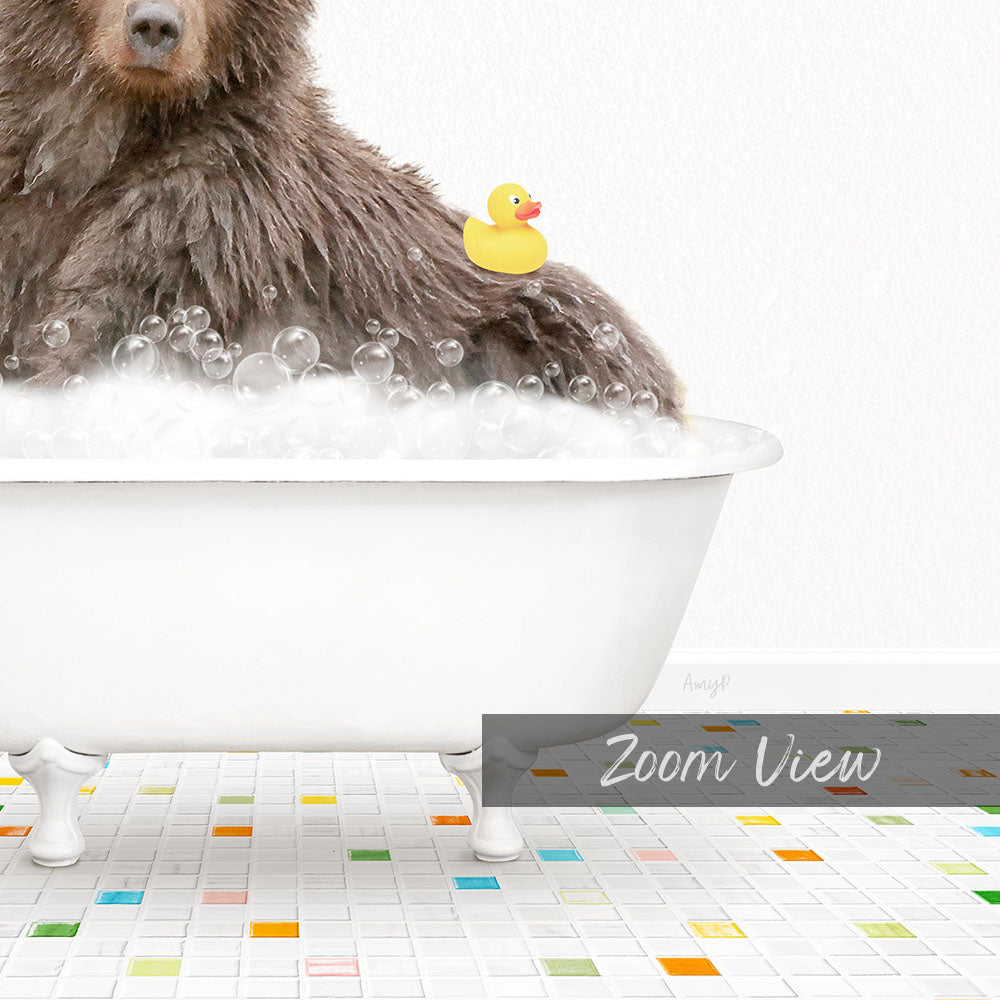 A brown bear sitting in a white bathtub filled with bubbles, with a yellow rubber duck floating on the water.