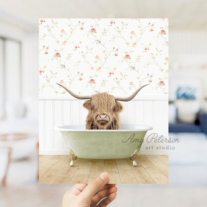 a hand holding up a card with a picture of a bull in a bathtub