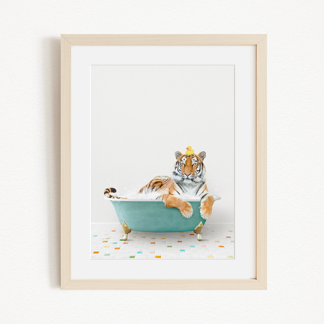 A tiger is sitting in a green bathtub, surrounded by colorful tiles on the floor.