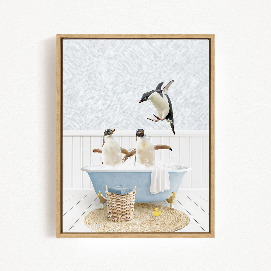 A framed image depicting two penguins sitting in a bathtub, with one penguin flying towards the other.