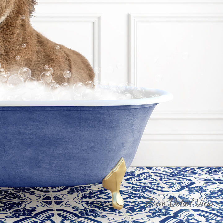 A dog is sitting in a blue bathtub filled with bubbles, with a patterned tile floor in the background.