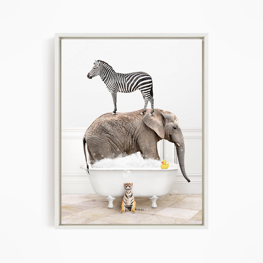 A zebra stands on an elephant's back while the elephant is submerged in a bathtub, with a small tiger figurine sitting nearby.