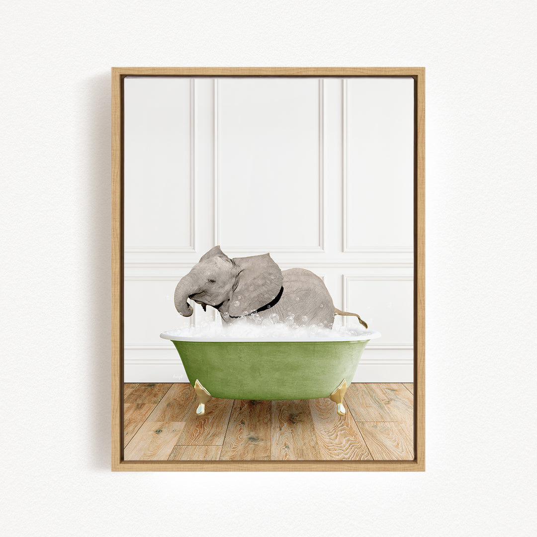 A gray elephant is sitting in a green bathtub, surrounded by bubbles, in a white-walled room with a wooden floor.