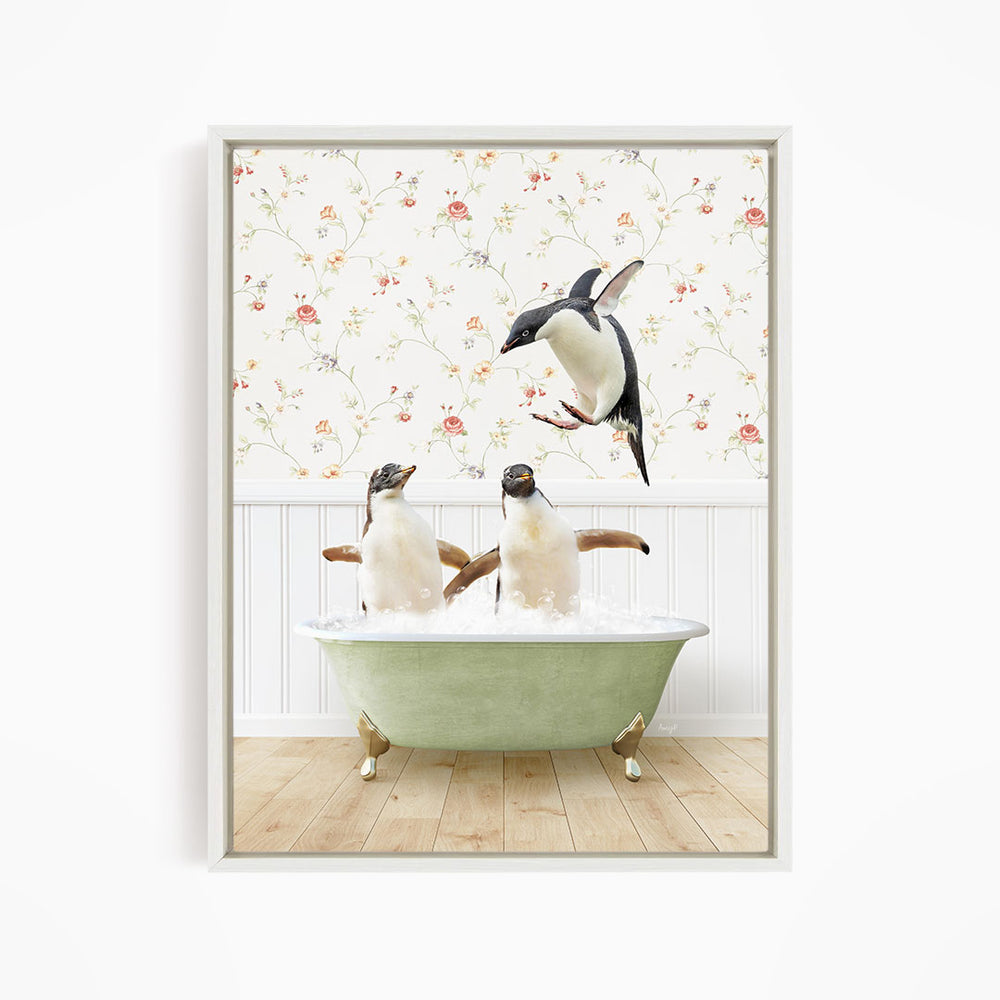 A framed image depicting two penguins sitting in a green bathtub, with one penguin flying towards the other in mid-air.