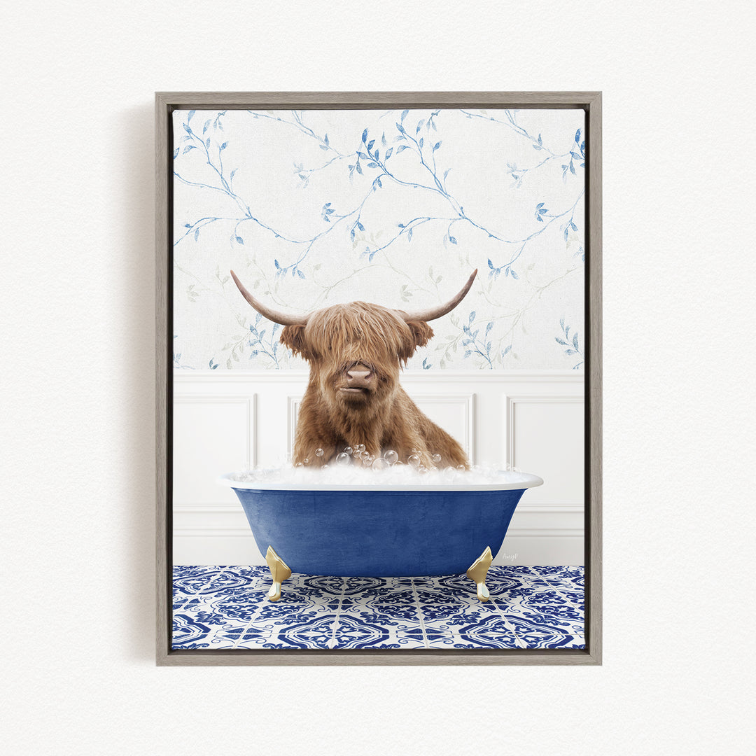 A Highland cow with long horns is sitting in a blue bathtub filled with bubbles, creating a whimsical and amusing scene.