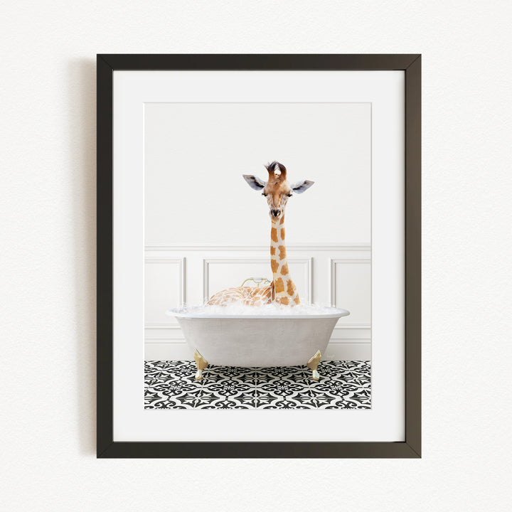 A giraffe is sitting in a white bathtub filled with bubbles, creating a whimsical and playful scene.