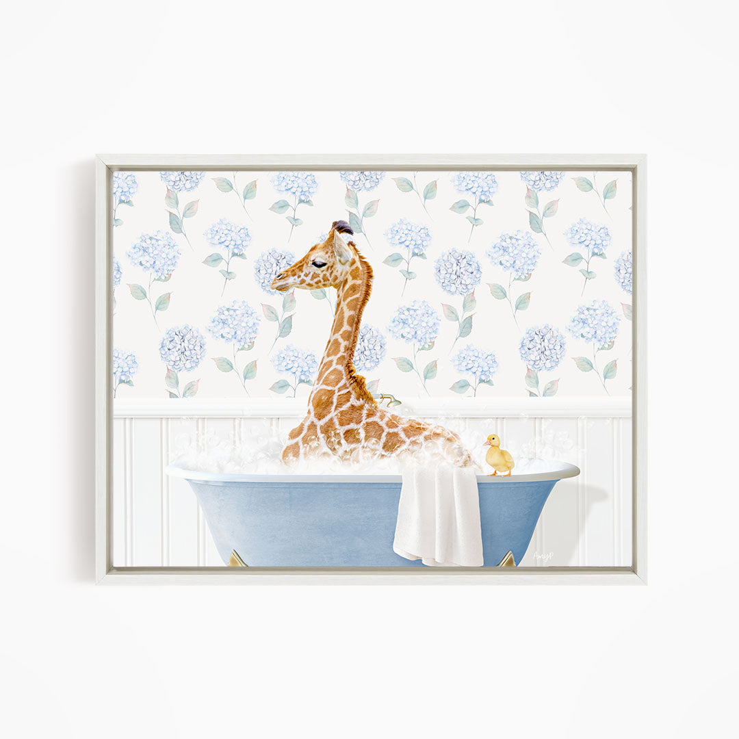 A giraffe sitting in a blue bathtub, surrounded by a floral patterned wall and a yellow duck.