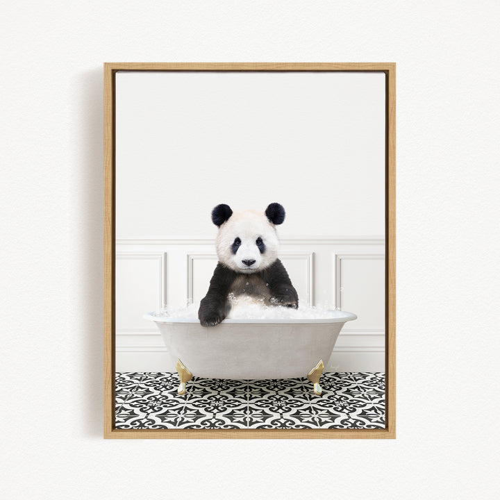 A panda bear sitting in a white bathtub filled with bubbles, surrounded by a black and white patterned floor.