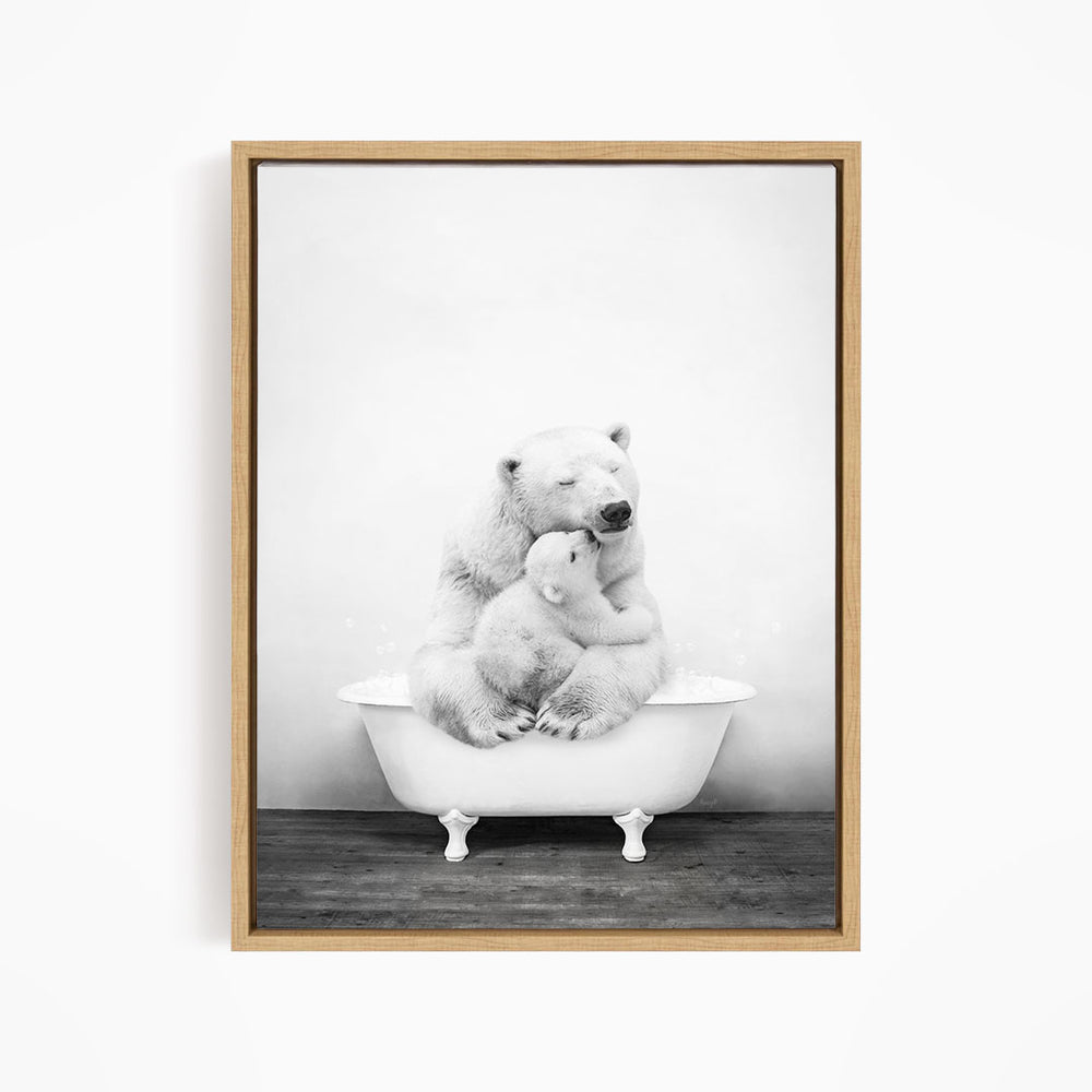 A black and white photograph of a mother polar bear sitting in a bathtub, with her cub nestled beside her.