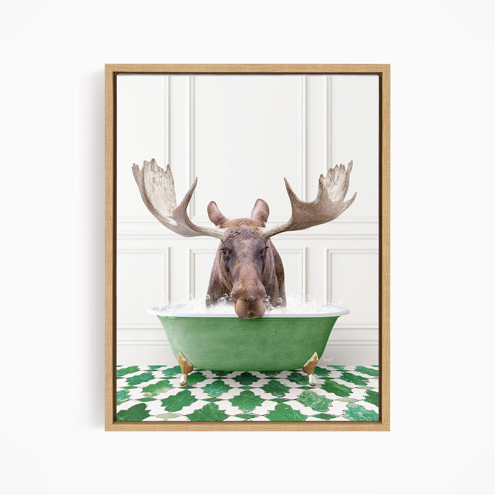 A moose with large antlers is sitting in a green bathtub filled with water, surrounded by a green and white patterned floor.