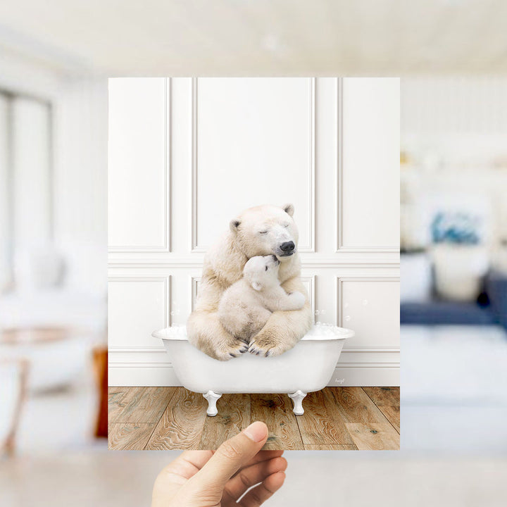 A polar bear cub is sitting in a bathtub, being held by an adult polar bear.