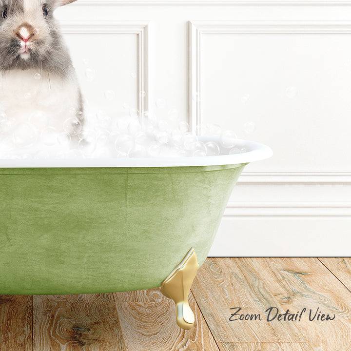 A small rabbit sitting in a green bathtub filled with bubbles, with a wooden floor and white walls in the background.