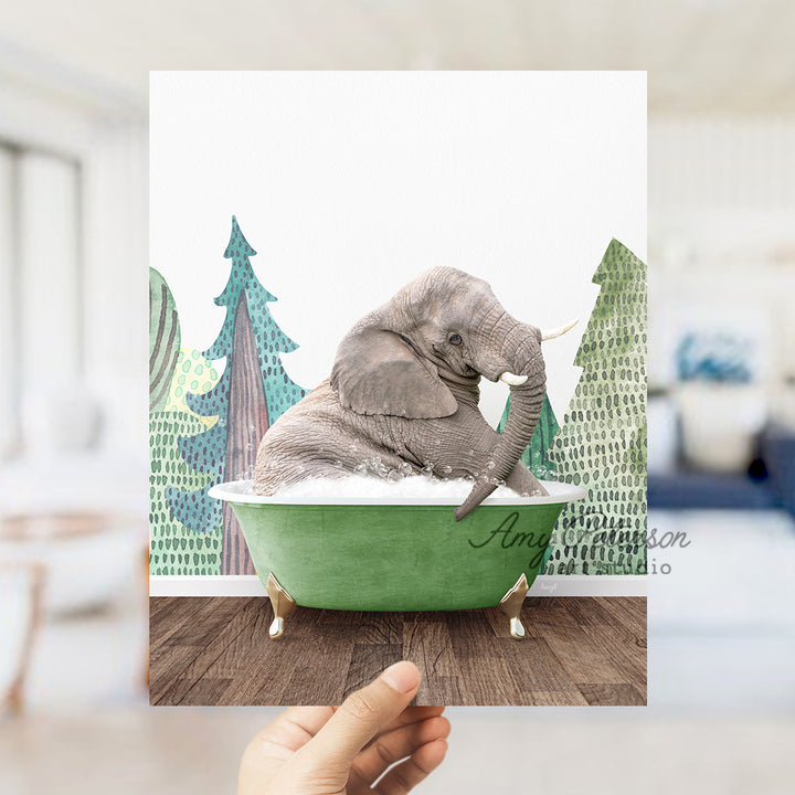 a person holding up a picture of an elephant in a bathtub