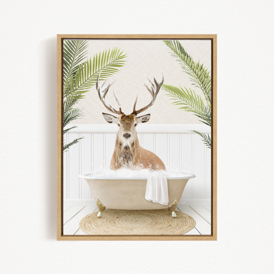 A deer with antlers is sitting in a bathtub filled with water, surrounded by green plants.